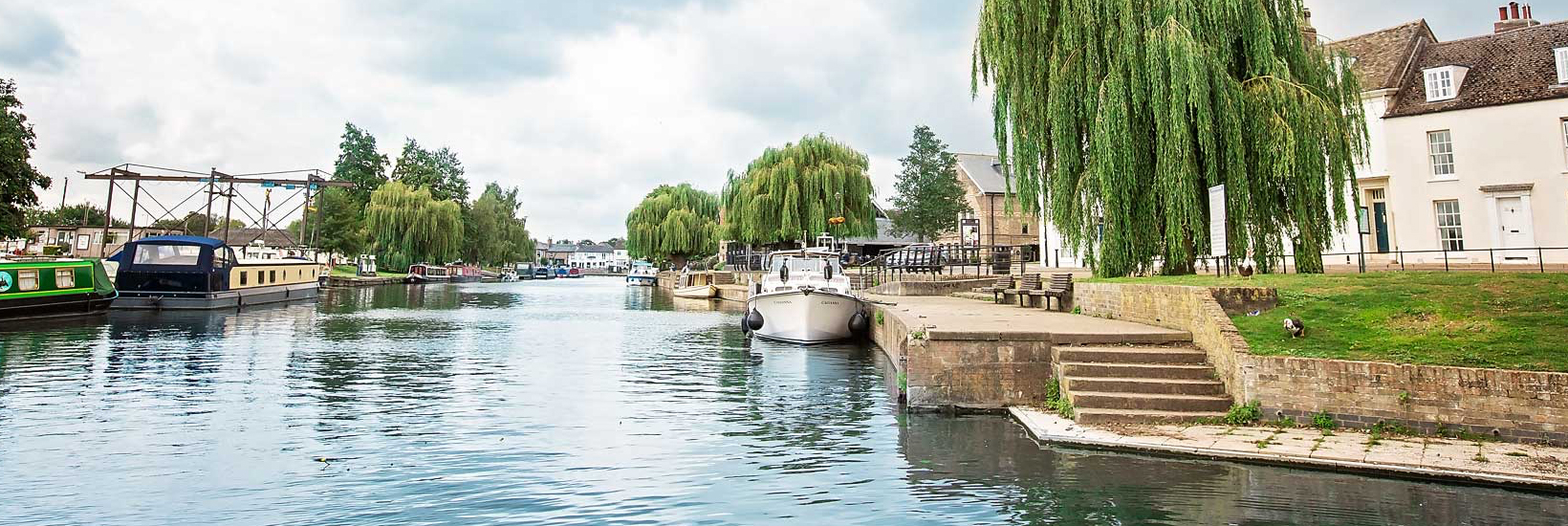 Explore East Cambs - boats on Ely river from low angle