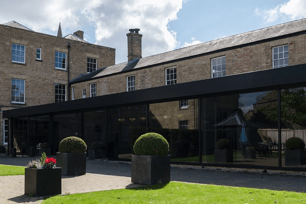 Places to stay in East Cambridgeshire - Exterior of The Poets House showing large windows onto garden